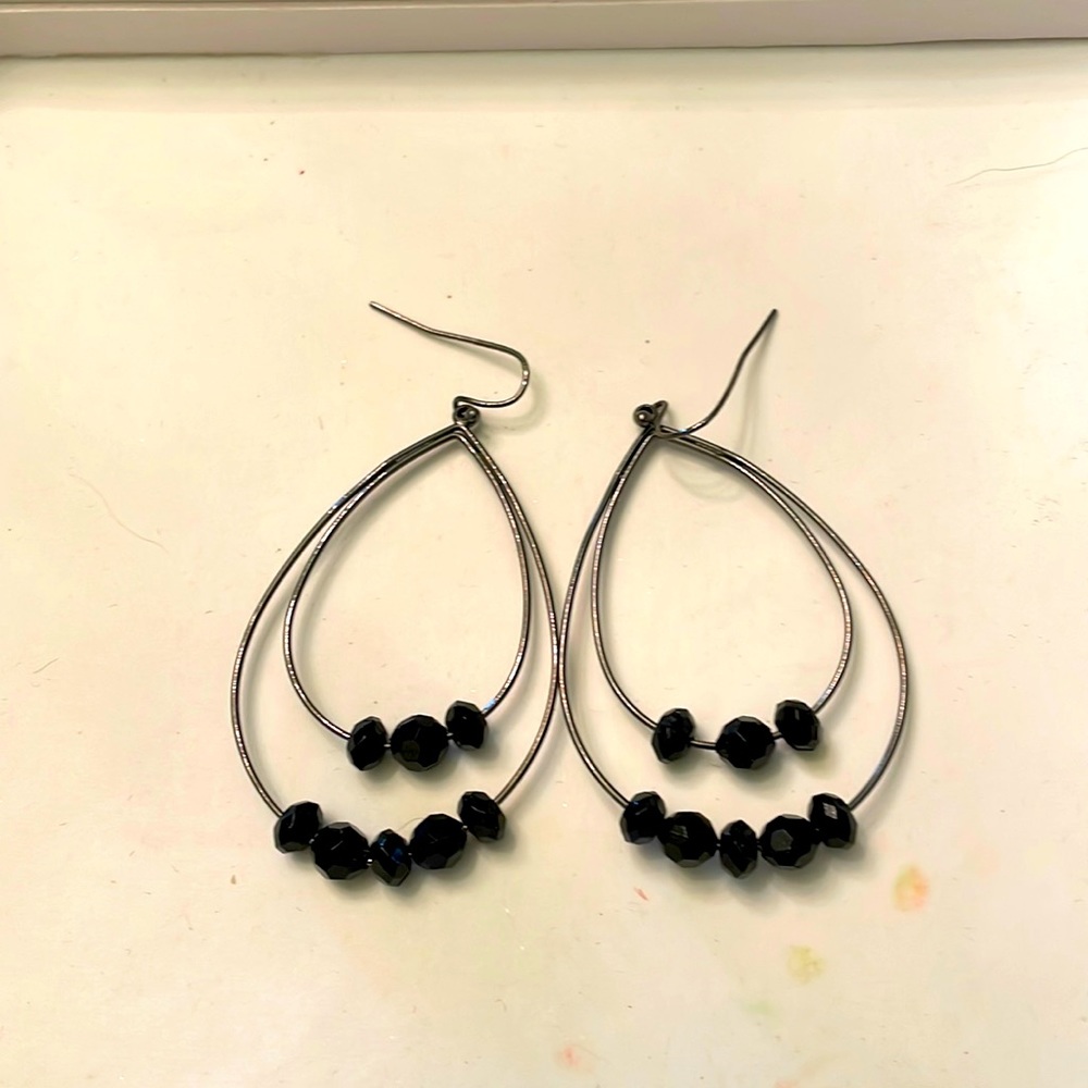 Black beaded oval hoop earrings